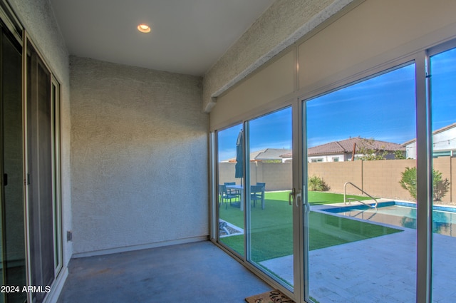 unfurnished sunroom with a wealth of natural light