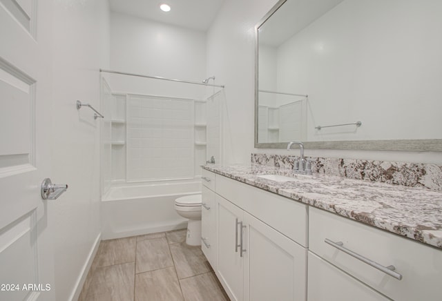 full bathroom with shower / washtub combination, vanity, and toilet