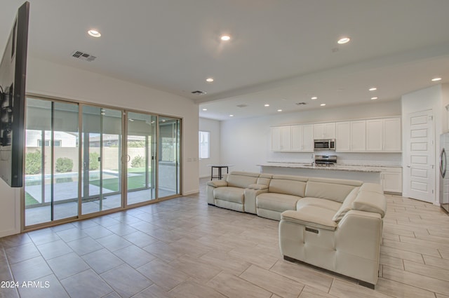 2228 E Isaiah Ave, Gilbert, AZ 85298 - living area featuring recessed lighting and baseboards