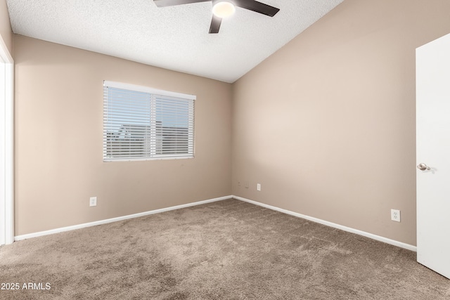 spare room featuring a textured ceiling, ceiling fan, and carpet floors