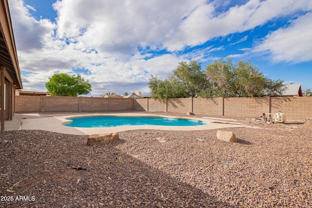 view of pool with a patio area, a fenced in pool, a diving board, and a fenced backyard