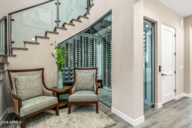 sitting room with hardwood / wood-style flooring