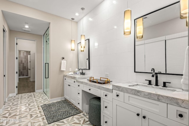 bathroom with an enclosed shower and vanity