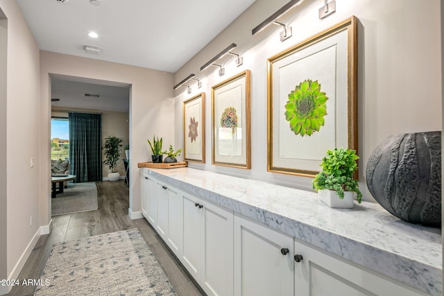 bathroom with vanity and hardwood / wood-style floors