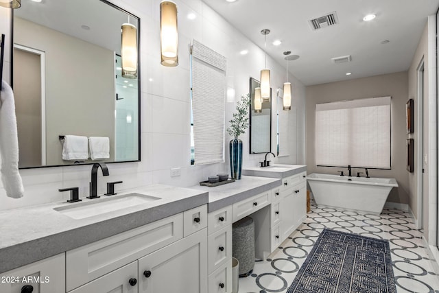 bathroom featuring a bathtub and vanity