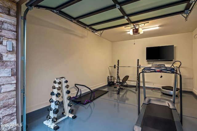 exercise room with concrete flooring