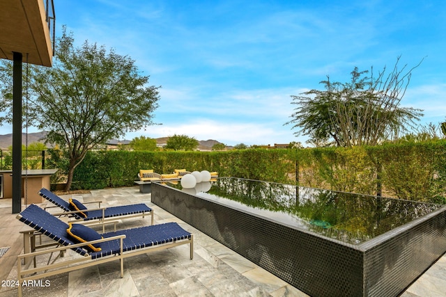 view of patio / terrace featuring a mountain view and outdoor lounge area