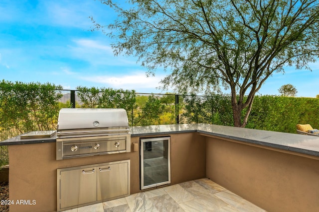 view of patio featuring grilling area and exterior kitchen