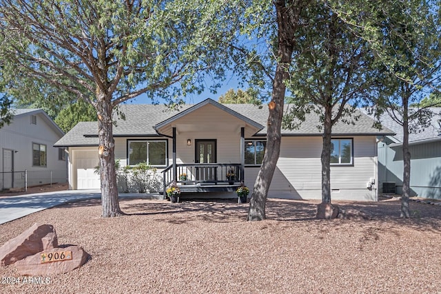 view of front of house featuring cooling unit and a garage