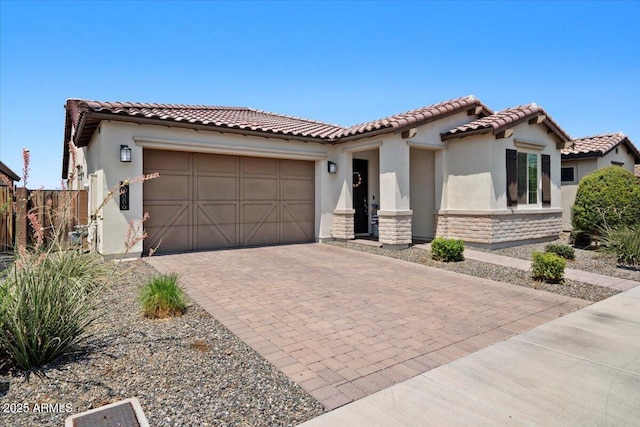 mediterranean / spanish house with a garage