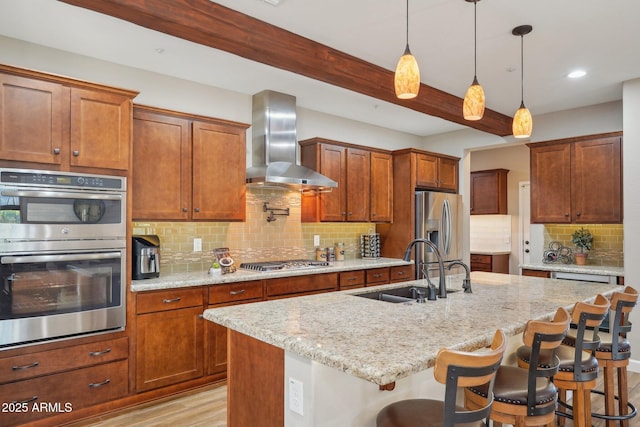 30342 N 130th Dr, Peoria, AZ 85383 - kitchen with wall chimney exhaust hood, beam ceiling, appliances with stainless steel finishes, a sink, and a kitchen breakfast bar