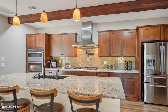 30342 N 130th Dr, Peoria, AZ 85383 - kitchen with visible vents, stainless steel appliances, tasteful backsplash, a sink, and wall chimney range hood