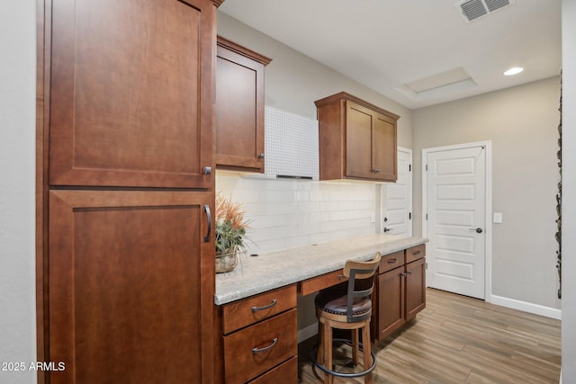 30342 N 130th Dr, Peoria, AZ 85383 - office featuring light wood-type flooring, baseboards, visible vents, built in desk, and recessed lighting