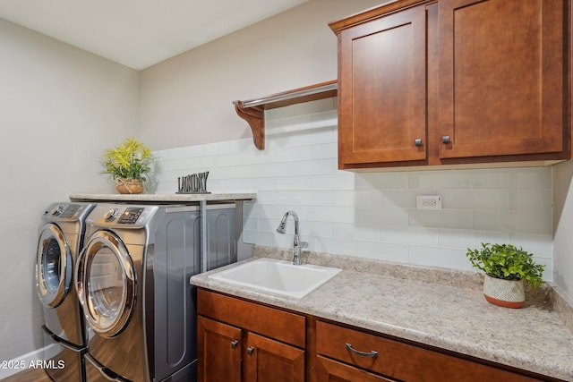 30342 N 130th Dr, Peoria, AZ 85383 - clothes washing area with washer and dryer, cabinet space, and a sink