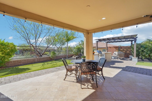 30342 N 130th Dr, Peoria, AZ 85383 - view of patio with an outdoor kitchen, area for grilling, fence, a pergola, and outdoor dining space