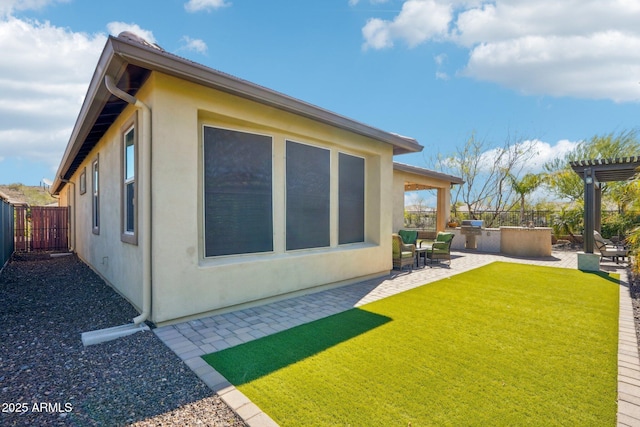 30342 N 130th Dr, Peoria, AZ 85383 - exterior space featuring a patio, exterior kitchen, and a fenced backyard