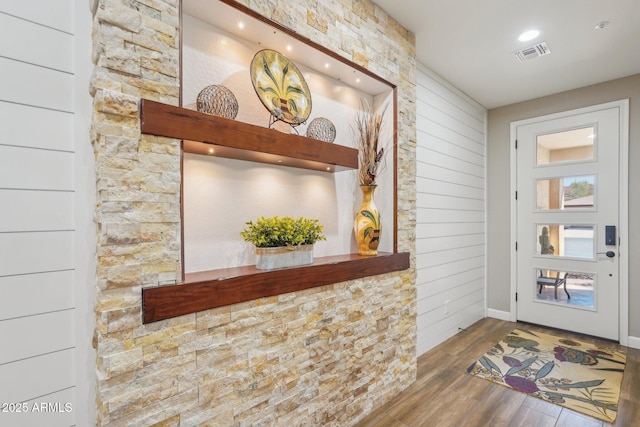 30342 N 130th Dr, Peoria, AZ 85383 - entryway with wood walls, visible vents, and wood finished floors