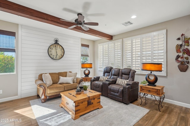 30342 N 130th Dr, Peoria, AZ 85383 - living room with baseboards, beam ceiling, ceiling fan, visible vents, and wood finished floors