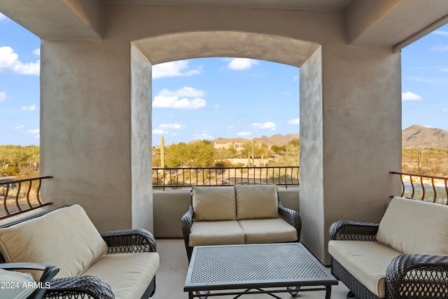 balcony featuring a mountain view