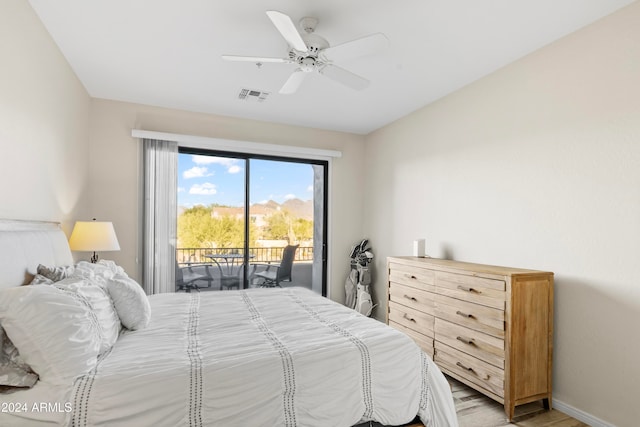 bedroom with access to exterior, light wood-type flooring, and ceiling fan