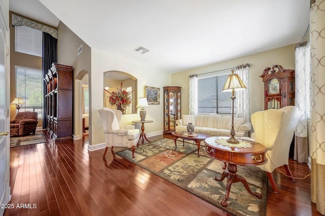 2726 S 160th Ave, Goodyear, AZ 85338 - sitting room featuring arched walkways, healthy amount of natural light, wood-type flooring, and baseboards