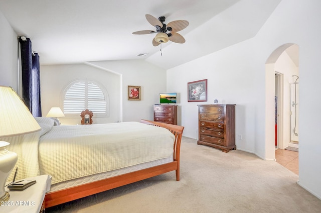 2726 S 160th Ave, Goodyear, AZ 85338 - bedroom with arched walkways, light colored carpet, lofted ceiling, and ceiling fan