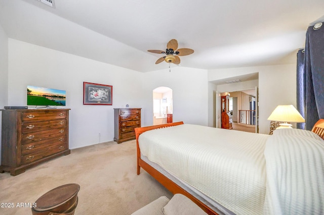 2726 S 160th Ave, Goodyear, AZ 85338 - bedroom with light colored carpet, arched walkways, and ceiling fan