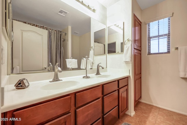 2726 S 160th Ave, Goodyear, AZ 85338 - bathroom with double vanity, tile patterned floors, baseboards, and a shower with shower curtain
