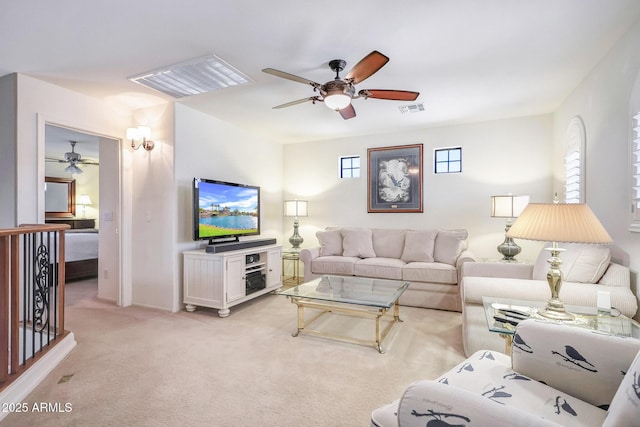 2726 S 160th Ave, Goodyear, AZ 85338 - living area with ceiling fan, healthy amount of natural light, and light carpet