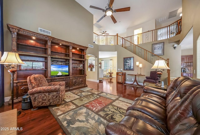 2726 S 160th Ave, Goodyear, AZ 85338 - living room featuring ceiling fan, wood finished floors, a high ceiling, and baseboards