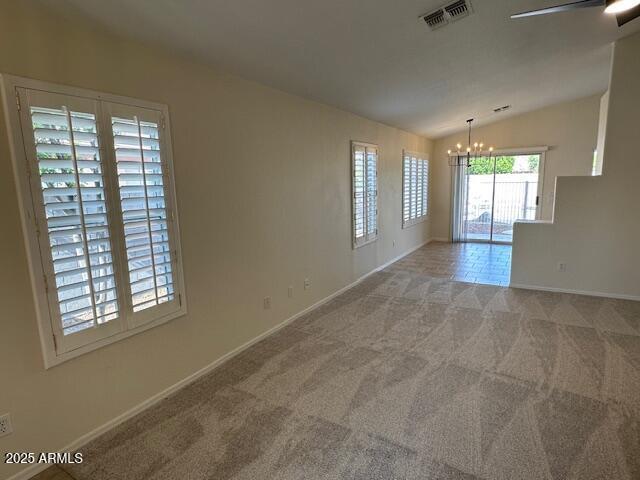 20275 N 81st Ln, Peoria, AZ 85382 - carpeted spare room with a chandelier, lofted ceiling, baseboards, and a ceiling fan
