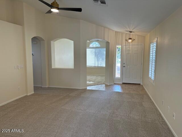 20275 N 81st Ln, Peoria, AZ 85382 - carpeted entrance foyer featuring ceiling fan, arched walkways, and baseboards