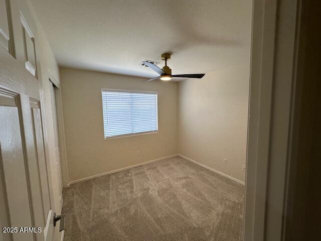 20275 N 81st Ln, Peoria, AZ 85382 - unfurnished room featuring carpet floors, ceiling fan, and baseboards