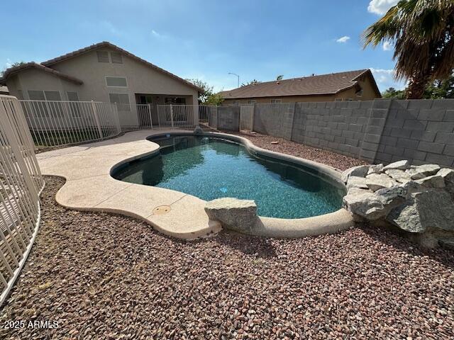 20275 N 81st Ln, Peoria, AZ 85382 - view of swimming pool with a fenced backyard and a patio