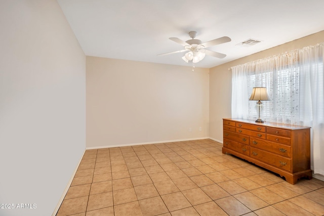23677 N Desert Dr, Florence, AZ 85132 - empty room with ceiling fan and light tile patterned flooring