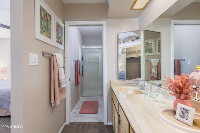 bathroom featuring walk in shower and vanity