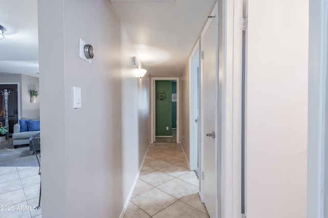 hall with light tile patterned floors