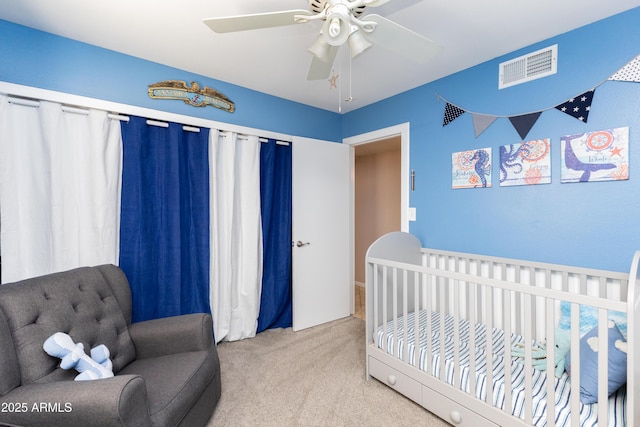 carpeted bedroom featuring ceiling fan