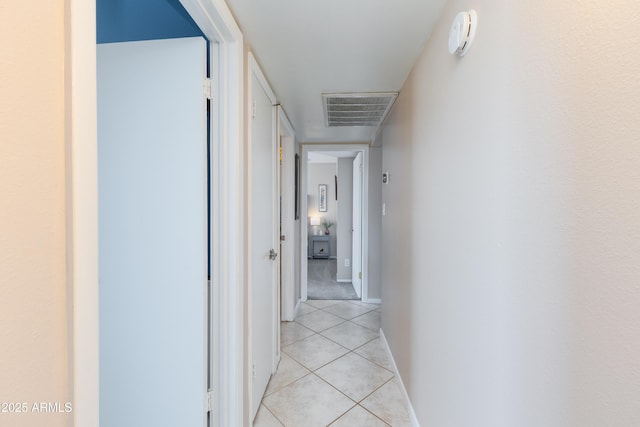 hallway featuring light tile patterned floors