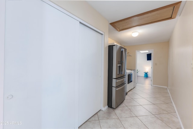 corridor featuring light tile patterned flooring