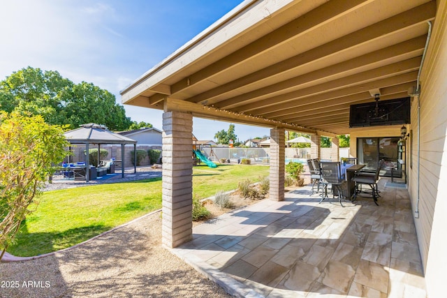 view of patio / terrace with a playground and a gazebo