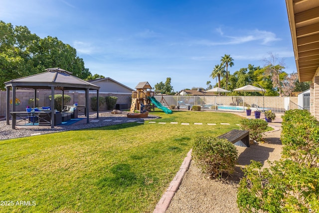 view of yard featuring a gazebo, an outdoor living space, a playground, and a fenced in pool