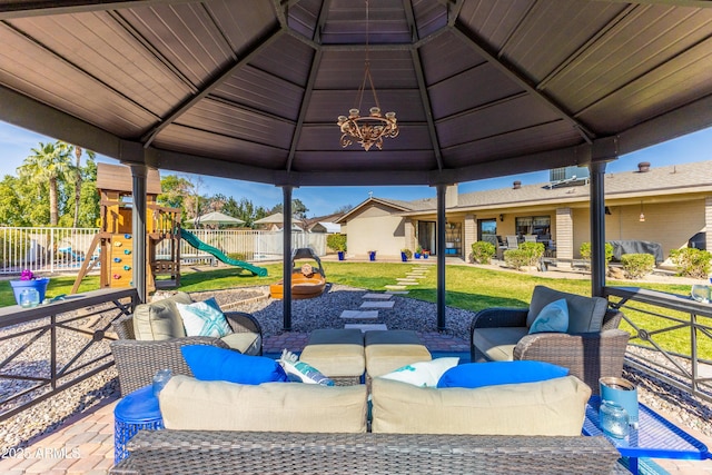 view of patio featuring an outdoor living space, a gazebo, and a playground