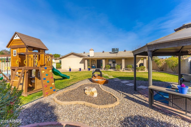 view of play area with a patio area and a lawn