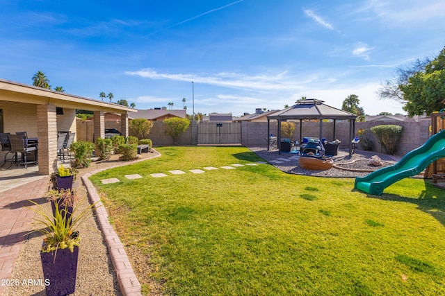 view of yard with a gazebo, a patio, and a playground