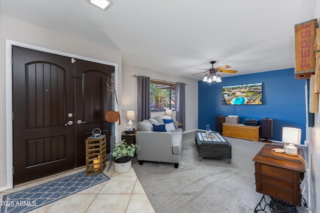 tiled living room with ceiling fan