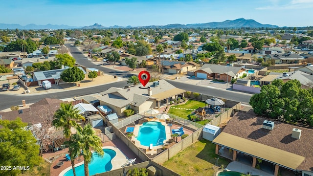 birds eye view of property featuring a mountain view