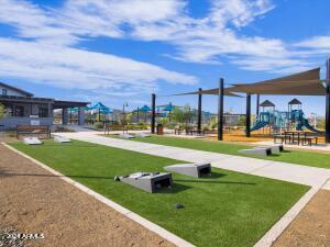 view of property's community with a yard and a playground