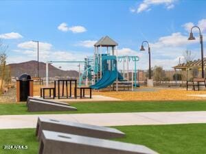 view of play area featuring a lawn