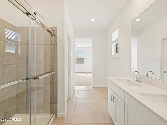 bathroom with tile patterned flooring, vanity, and a shower with shower door